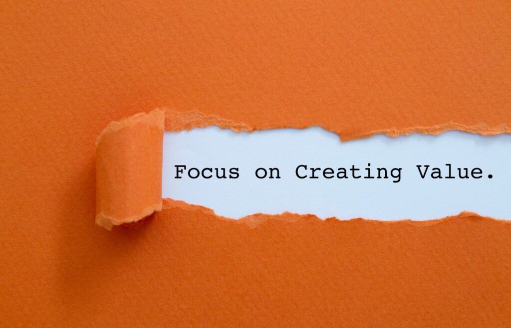 says the words 'Focus on Creating Value' on an orange background