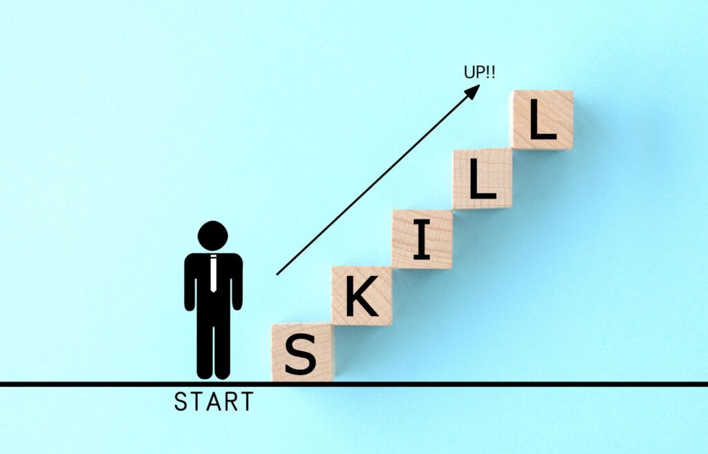 Shows an 'upskill' graphic with a stick figure and the word 'Skill'