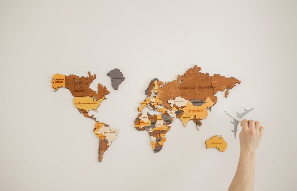 Shows a world map with a model aeroplane - How to get into copywriting