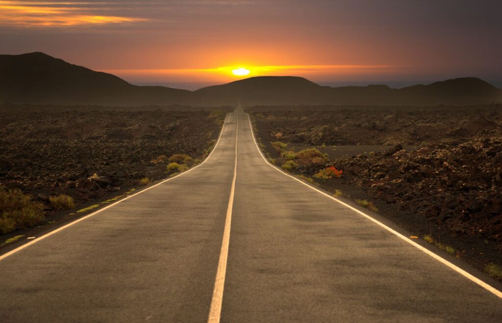 Shows a long and empty road - Travel agency marketing ideas