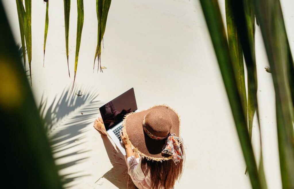 Shows a digital nomad working in a travel destination