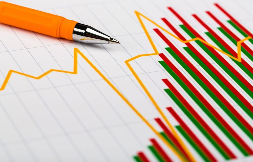 180+ Marketing statistics - Shows a coloured bar chart graph and a pencil