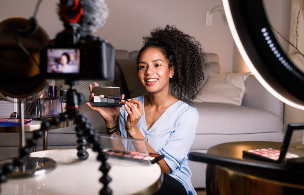 shows a woman filming her makeup look - content marketing statistics for 2024