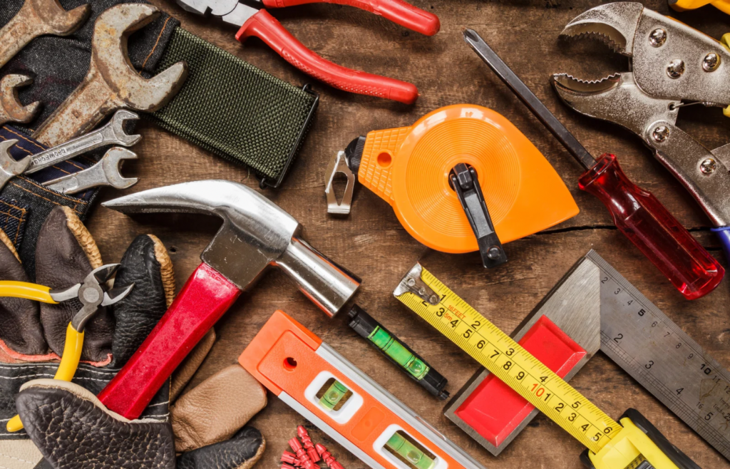 shows a variety of tools on a wooden table 