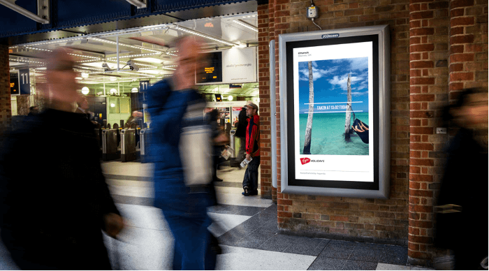 shows a blurred screen shot of people walking through a train station - 30 content marketing examples to inspire you