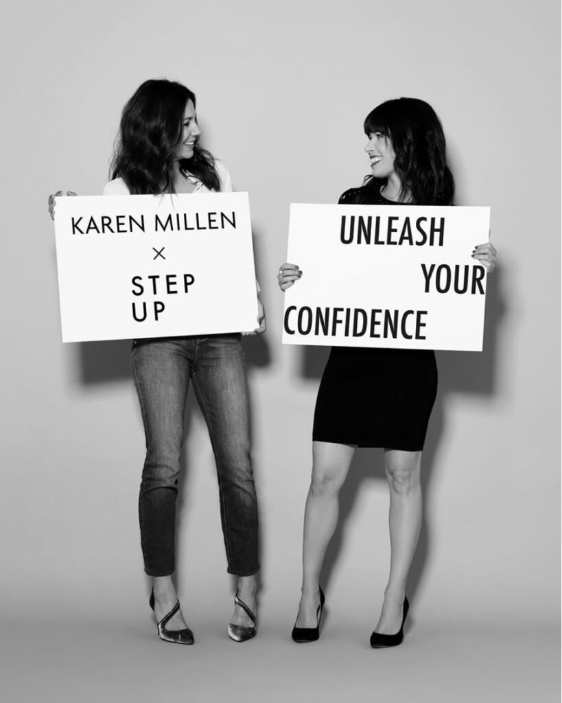 shows 2 women holding signs facing each other 