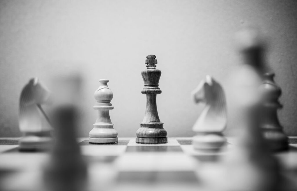 shows a black and white image of a chess board 