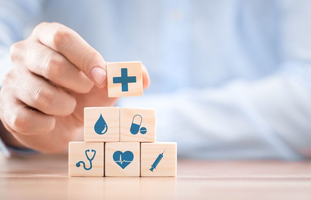 shows someone building scrabble blocks - healthcare marketing ezamples